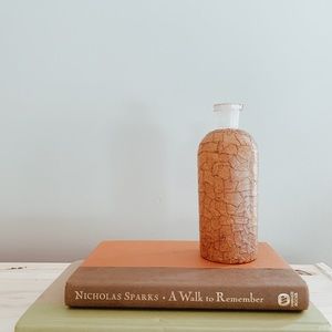 glass jar with leather detailing on sides